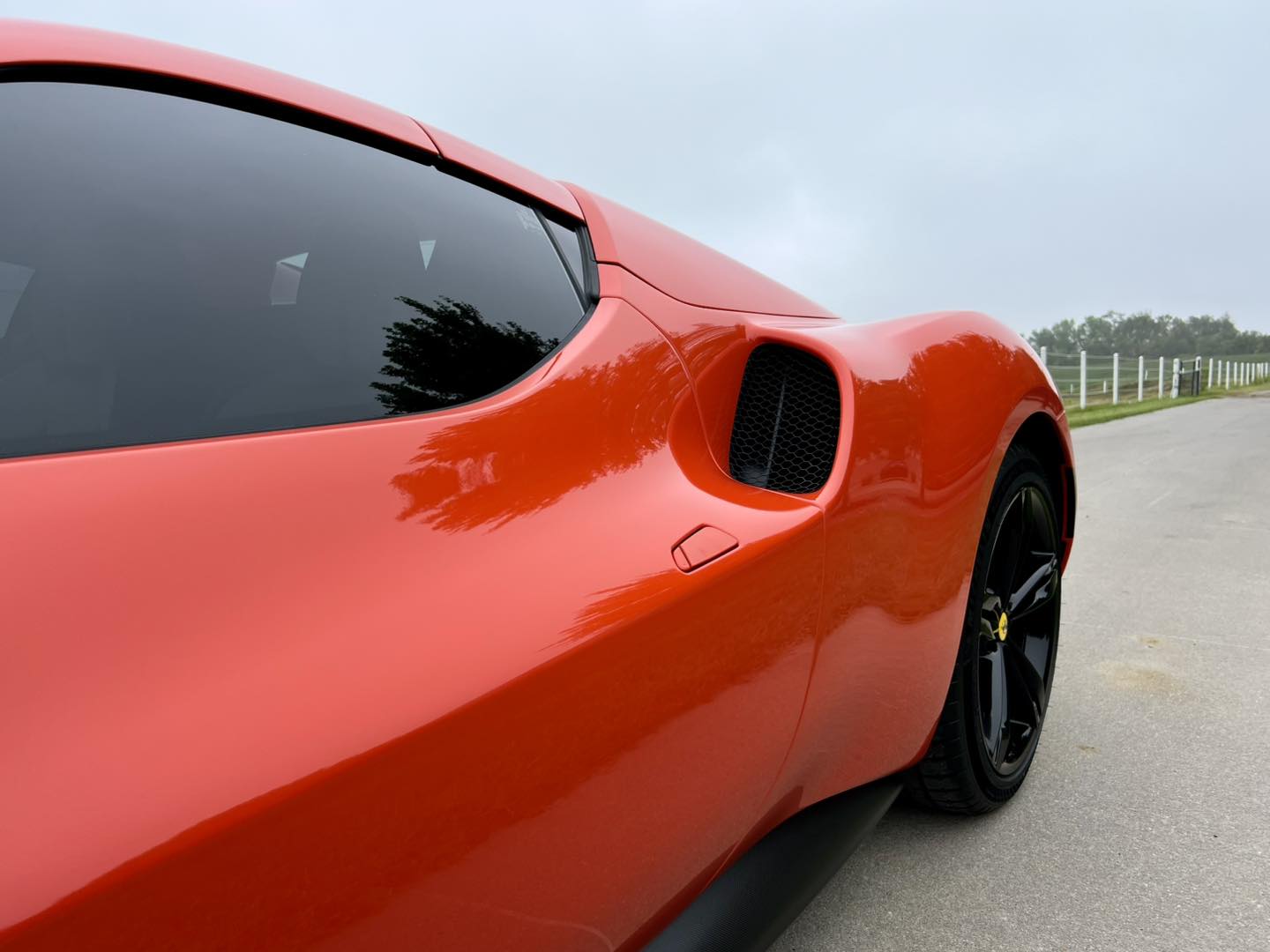 Orange Ferrari after a full exterior detail