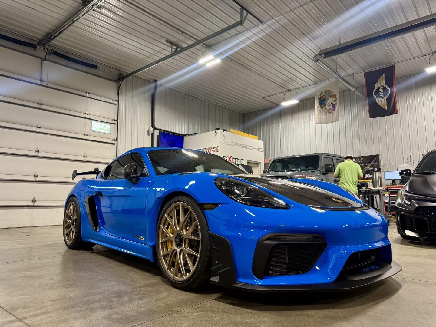 Blue sports car with a deep ceramic-coated finish