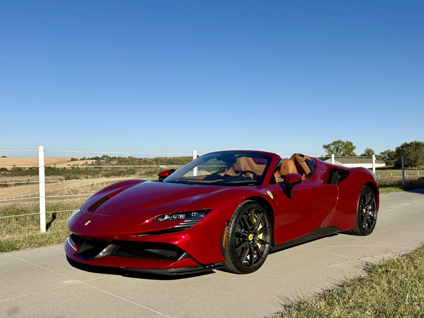 Red Ferrari SF90 with a mirror finish after detailing